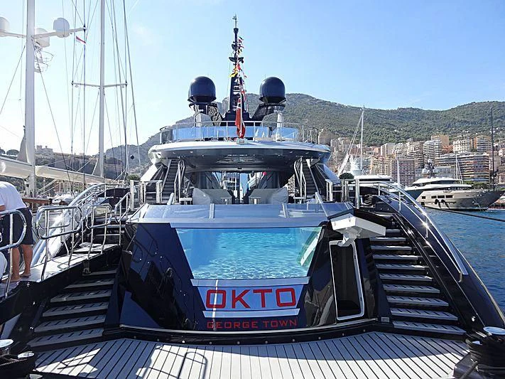 a boat docked at a pier aboard OKTO Yacht for Charter