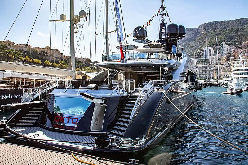 a boat docked at a pier aboard OKTO Yacht for Charter