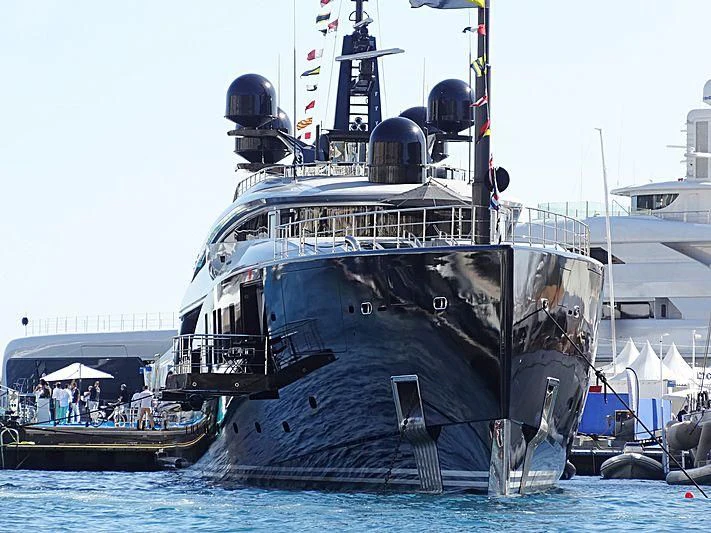 a large ship docked aboard OKTO Yacht for Charter