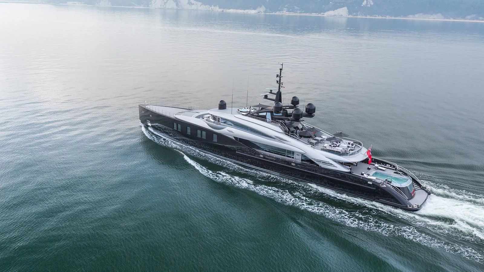 a military ship in the water aboard OKTO Yacht for Charter