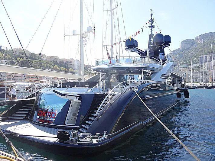 a boat docked at a pier aboard OKTO Yacht for Charter