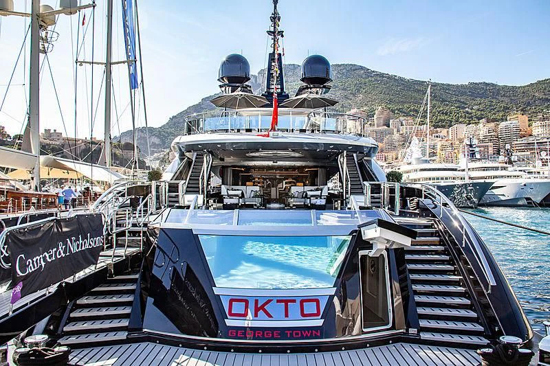 a boat docked at a pier aboard OKTO Yacht for Charter