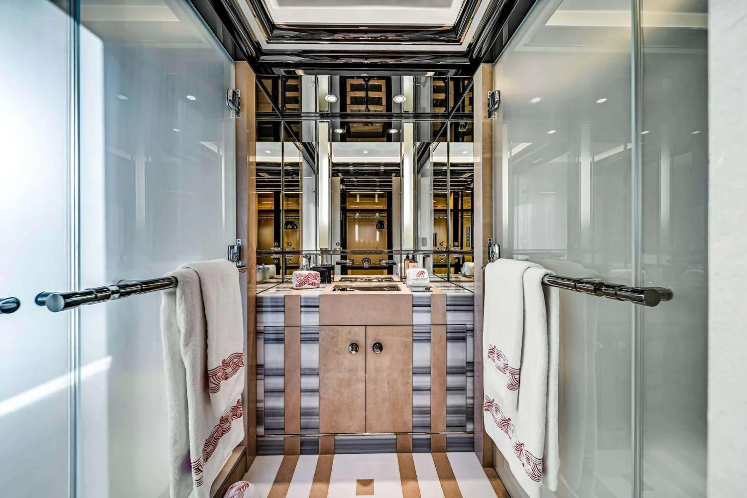 a bathroom with a sink and a mirror aboard OKTO Yacht for Charter