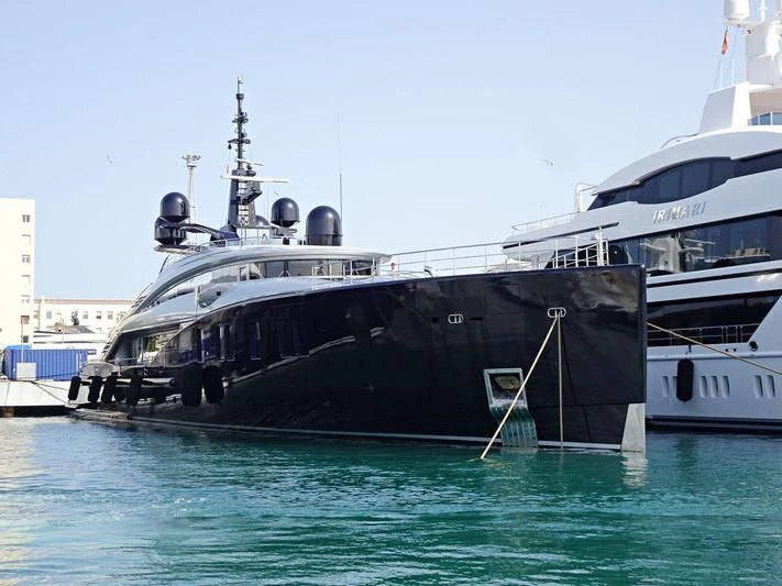 a boat docked at a pier aboard OKTO Yacht for Charter