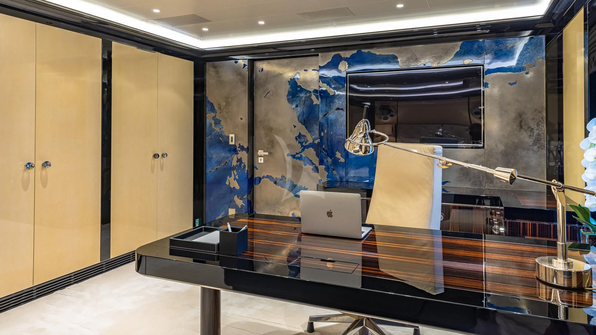 a laptop on a table aboard OKTO Yacht for Charter