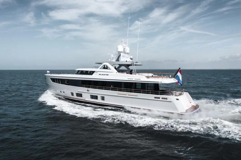 a white and black boat aboard SOLEMATES Yacht for Sale