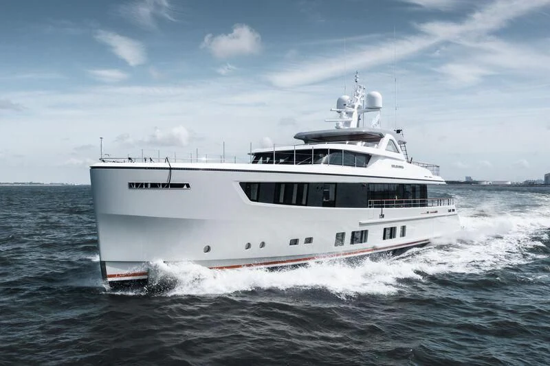 a white boat on the water aboard SOLEMATES Yacht for Sale