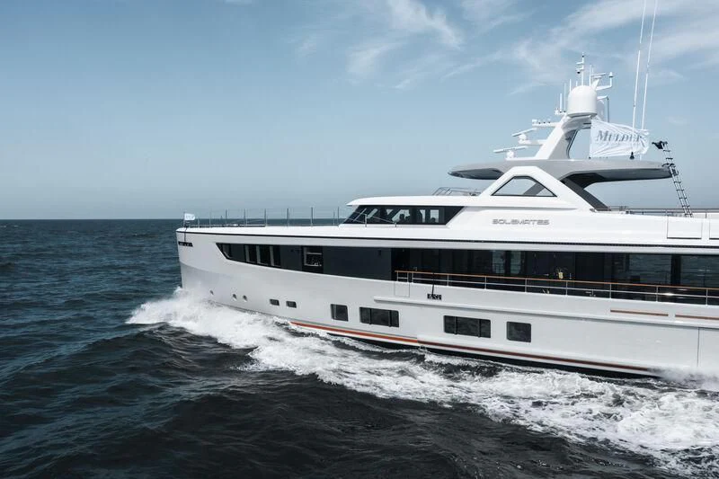 a white boat on the water aboard SOLEMATES Yacht for Sale