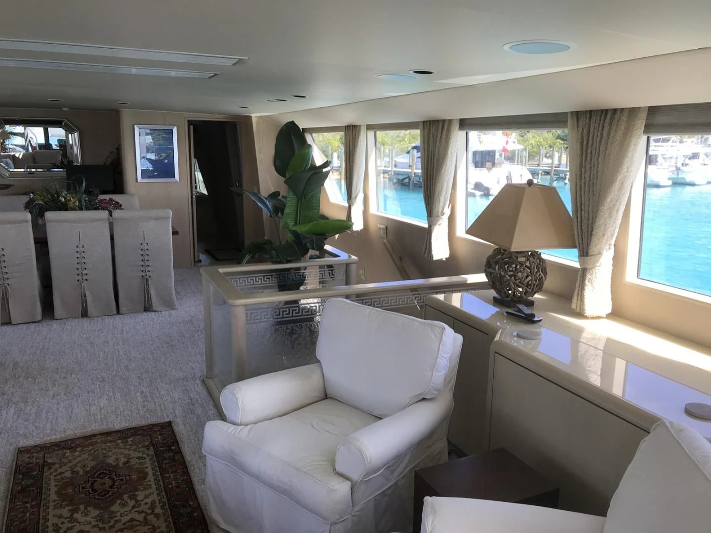 a room with a couch and a lamp on a desk aboard MON SHERI Yacht for Sale