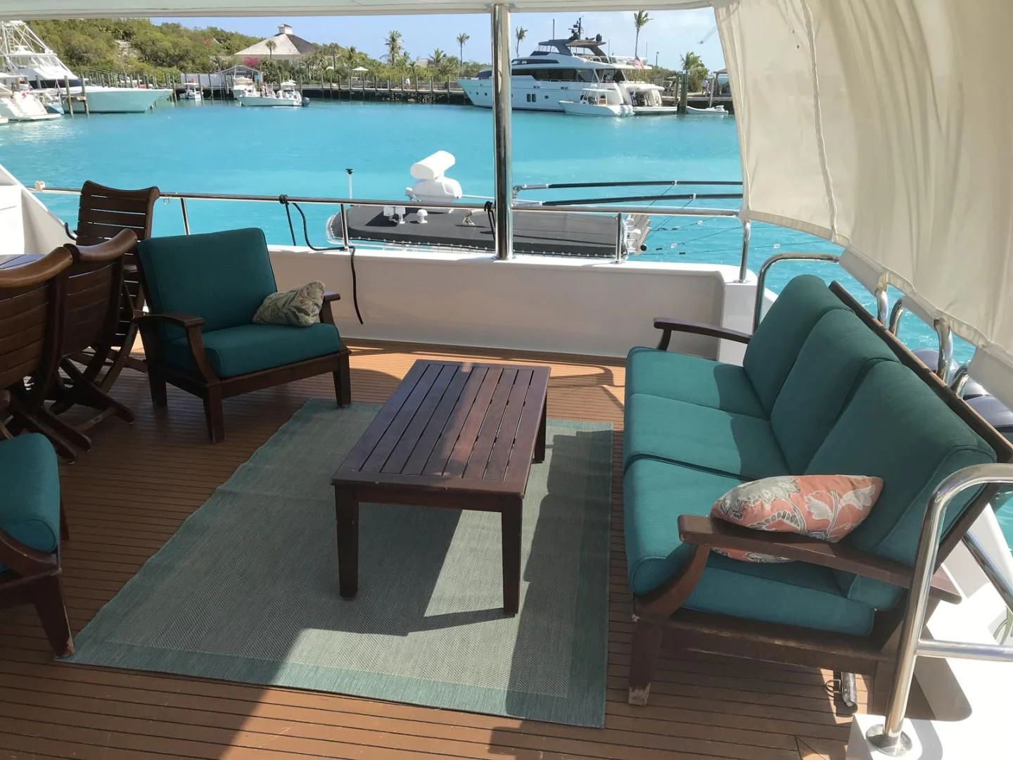a table and chairs on a deck aboard MON SHERI Yacht for Sale