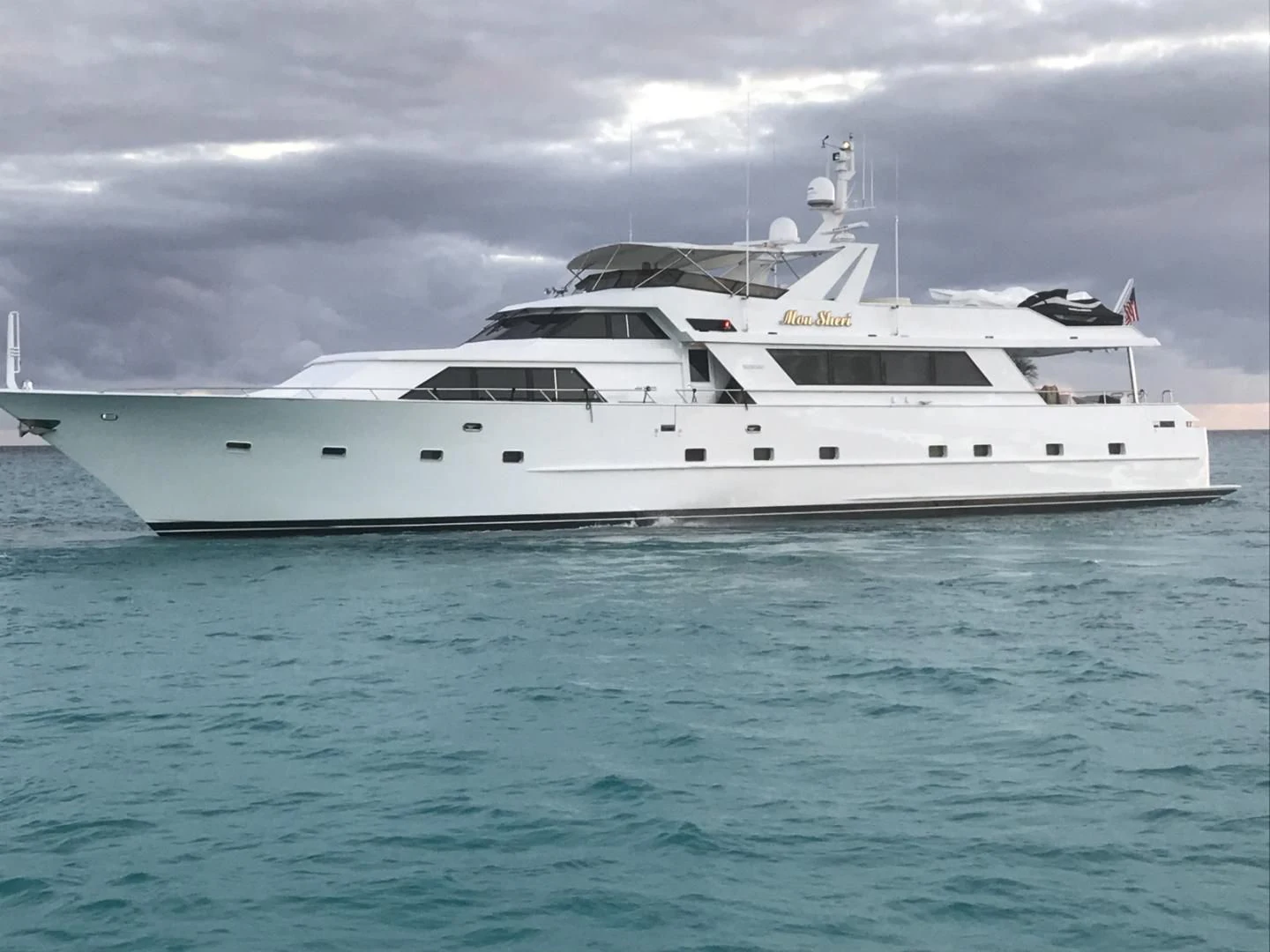 a white yacht in the water aboard MON SHERI Yacht for Sale