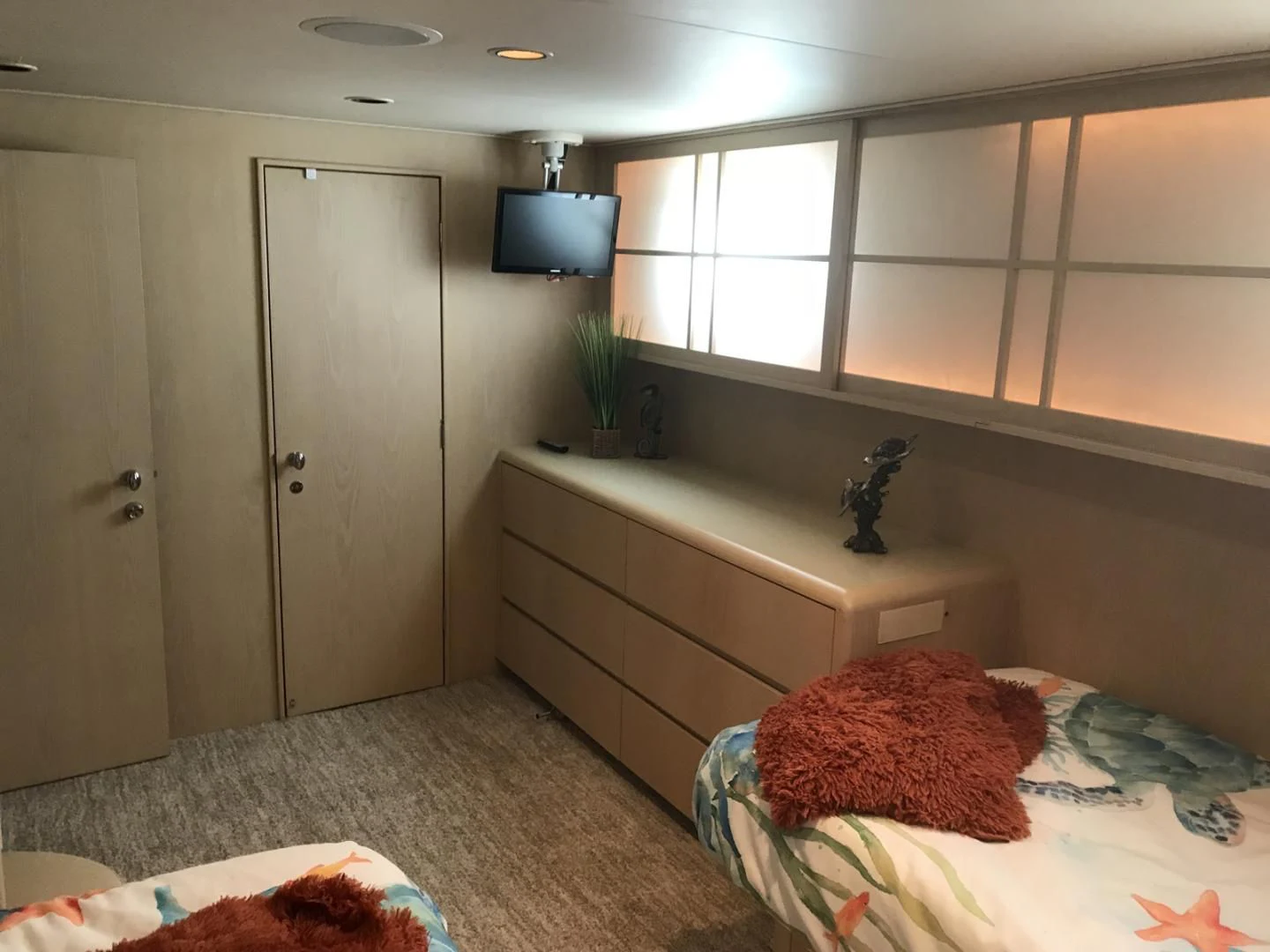 a room with a bed and a desk aboard MON SHERI Yacht for Sale