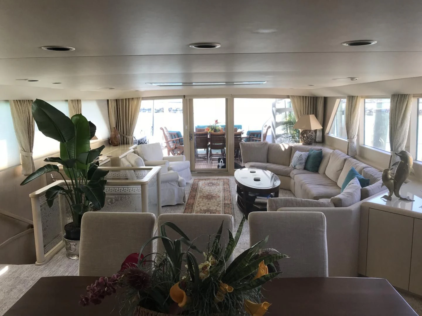 a living room with a large window aboard MON SHERI Yacht for Sale