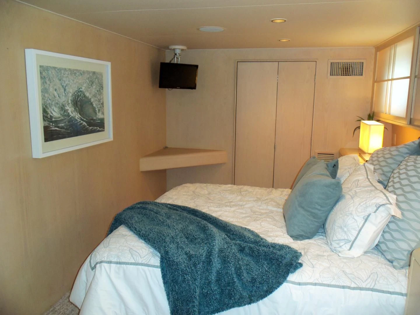 a bed with white sheets aboard MON SHERI Yacht for Sale
