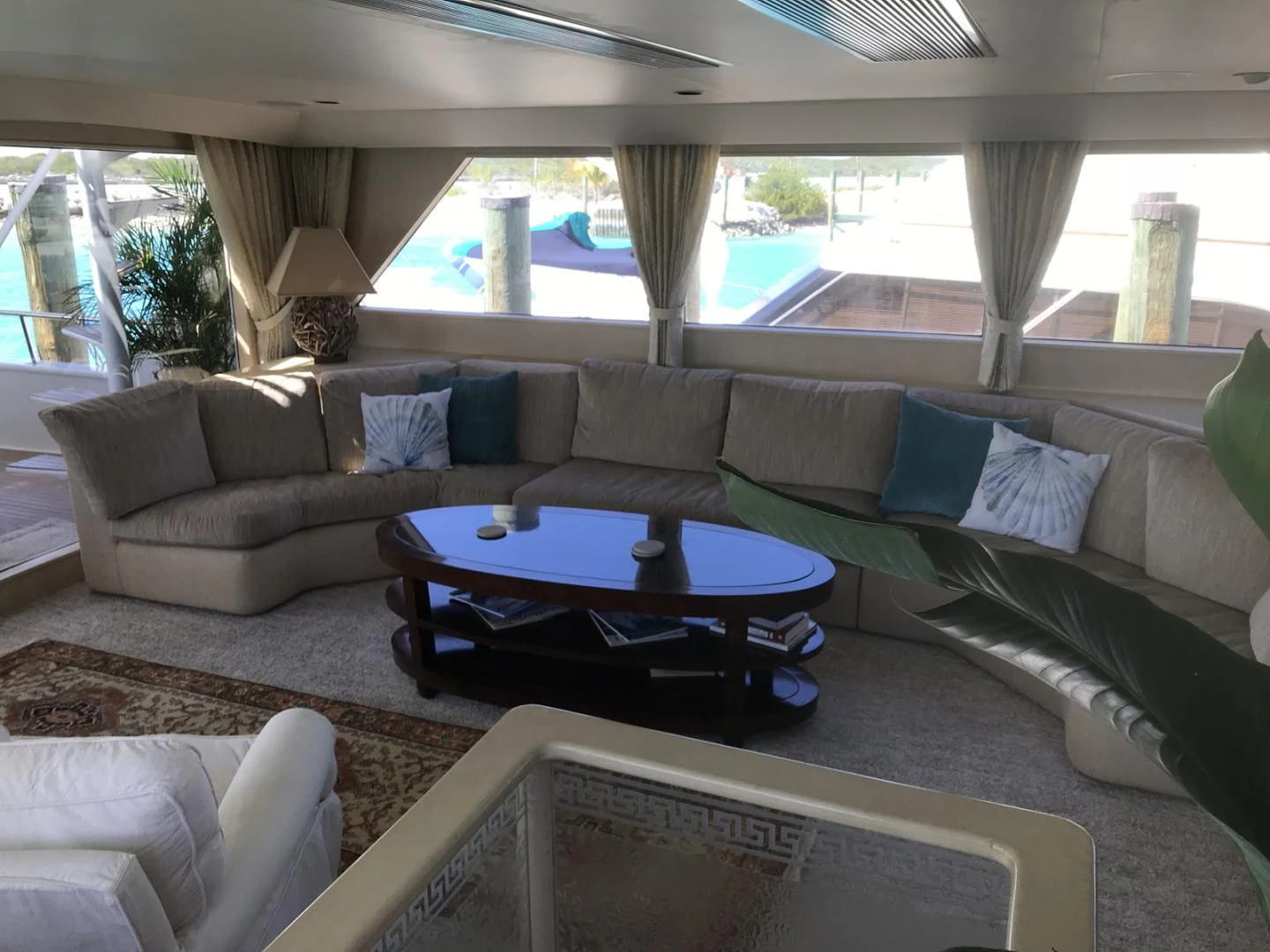 a living room with a couch and a table aboard MON SHERI Yacht for Sale