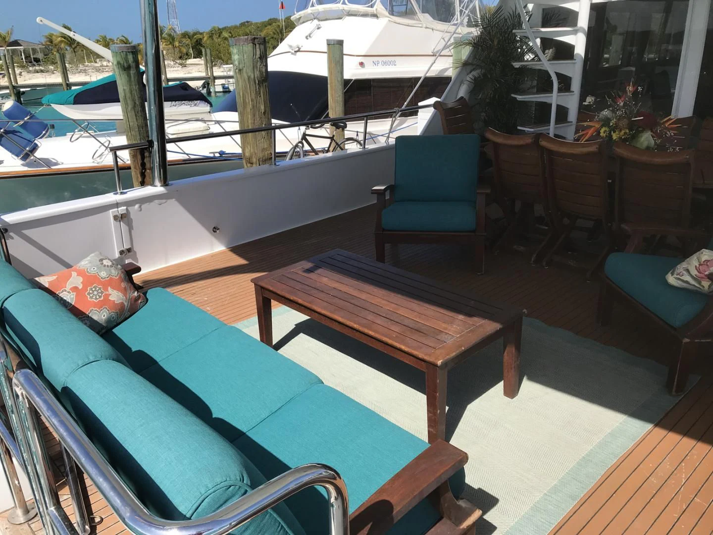 a table and chairs on a deck aboard MON SHERI Yacht for Sale
