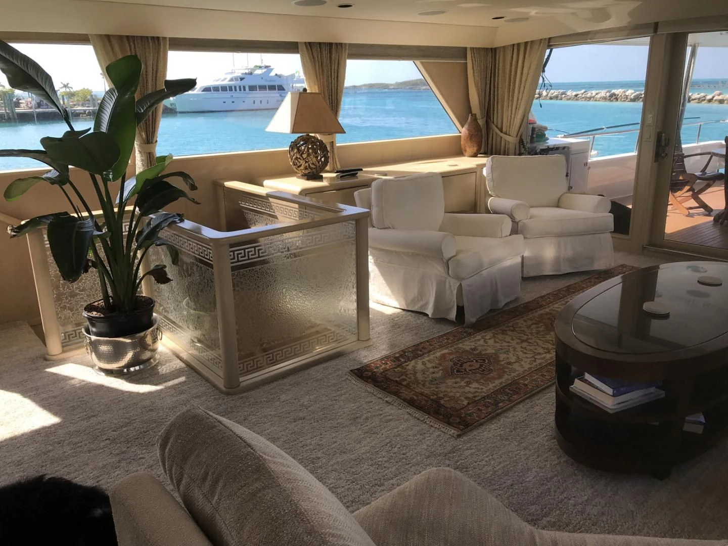 a living room with a couch and a table aboard MON SHERI Yacht for Sale