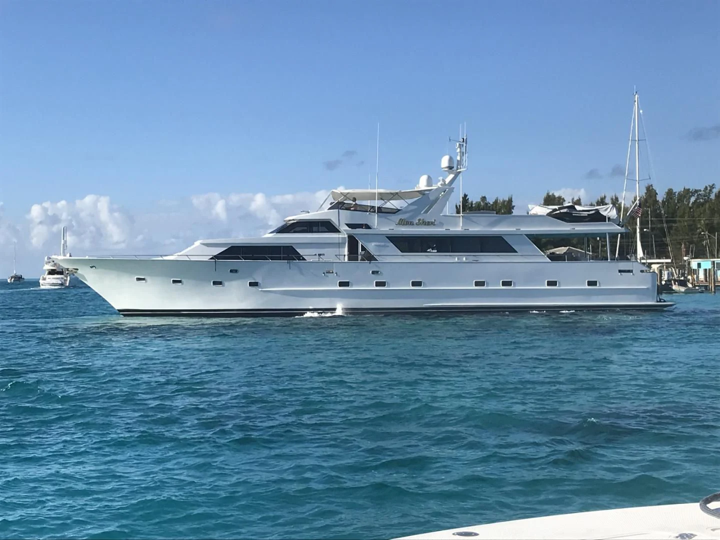 a white yacht in the water aboard MON SHERI Yacht for Sale