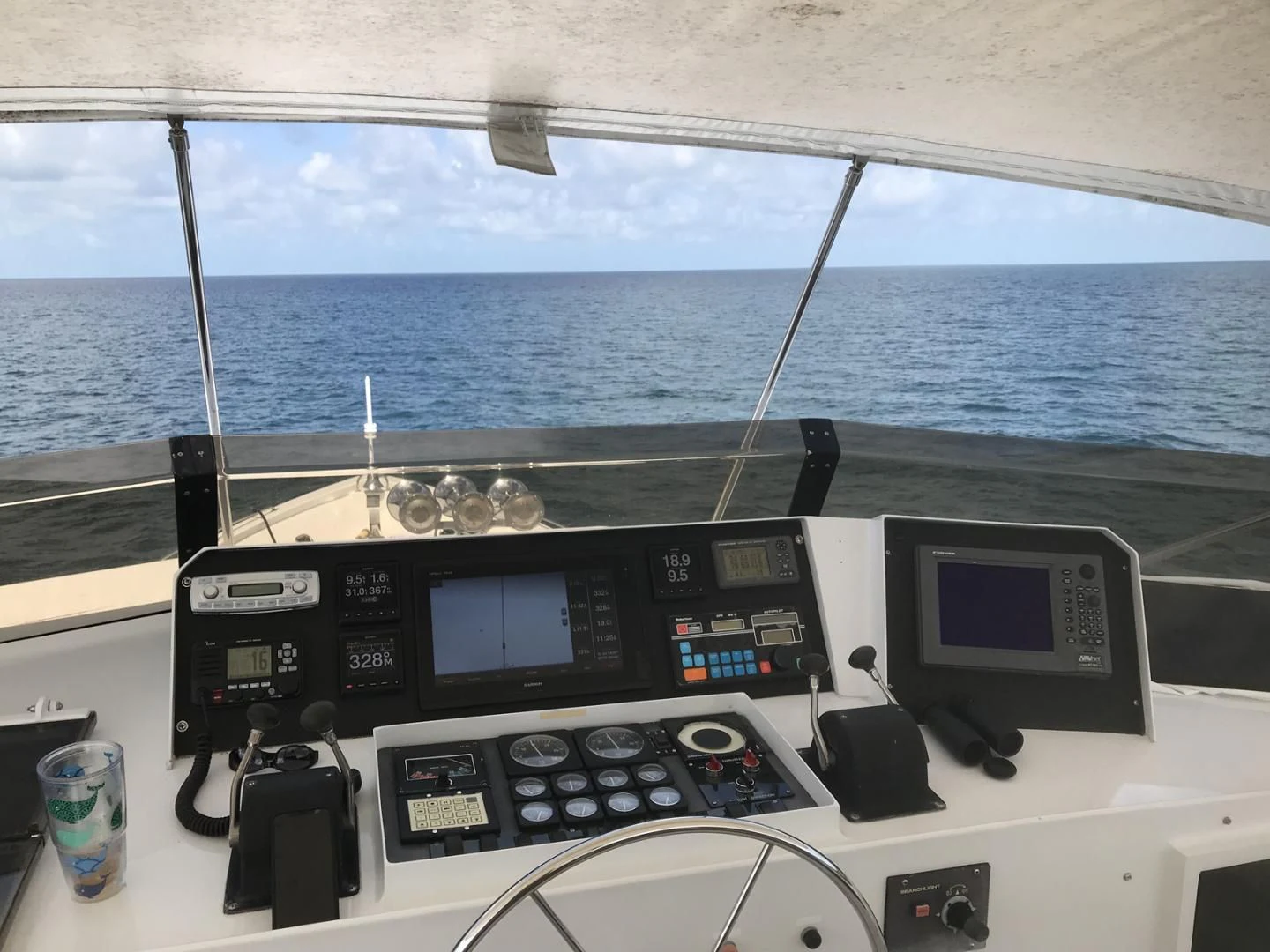 a boat with a couple of monitors and a couple of cups on the deck aboard MON SHERI Yacht for Sale