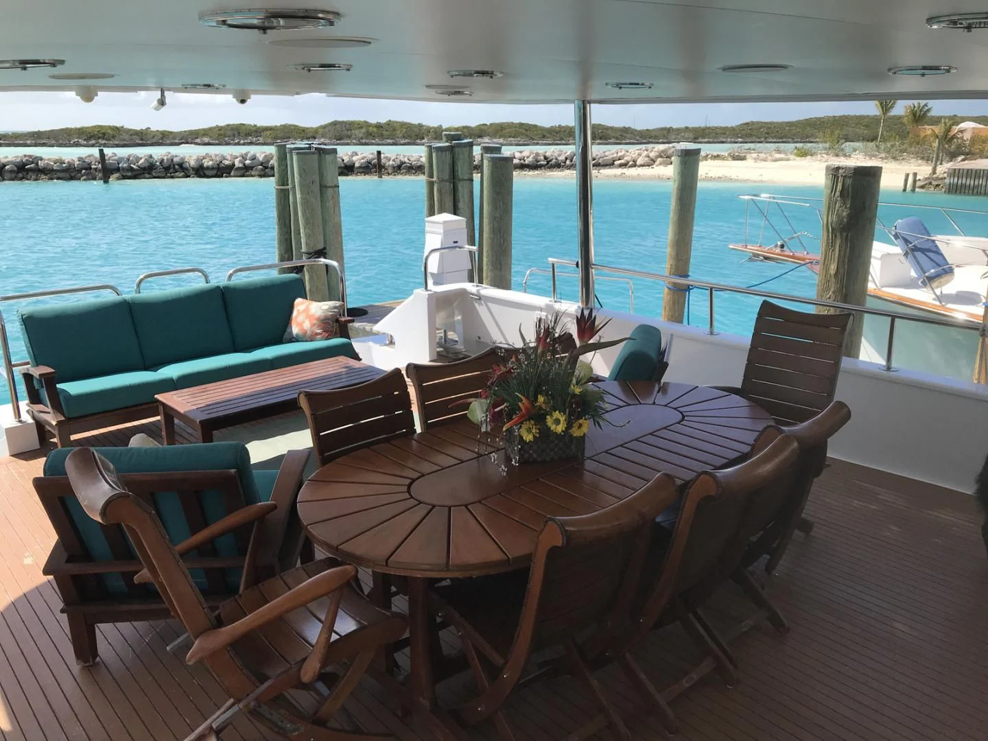 a table and chairs on a deck aboard MON SHERI Yacht for Sale