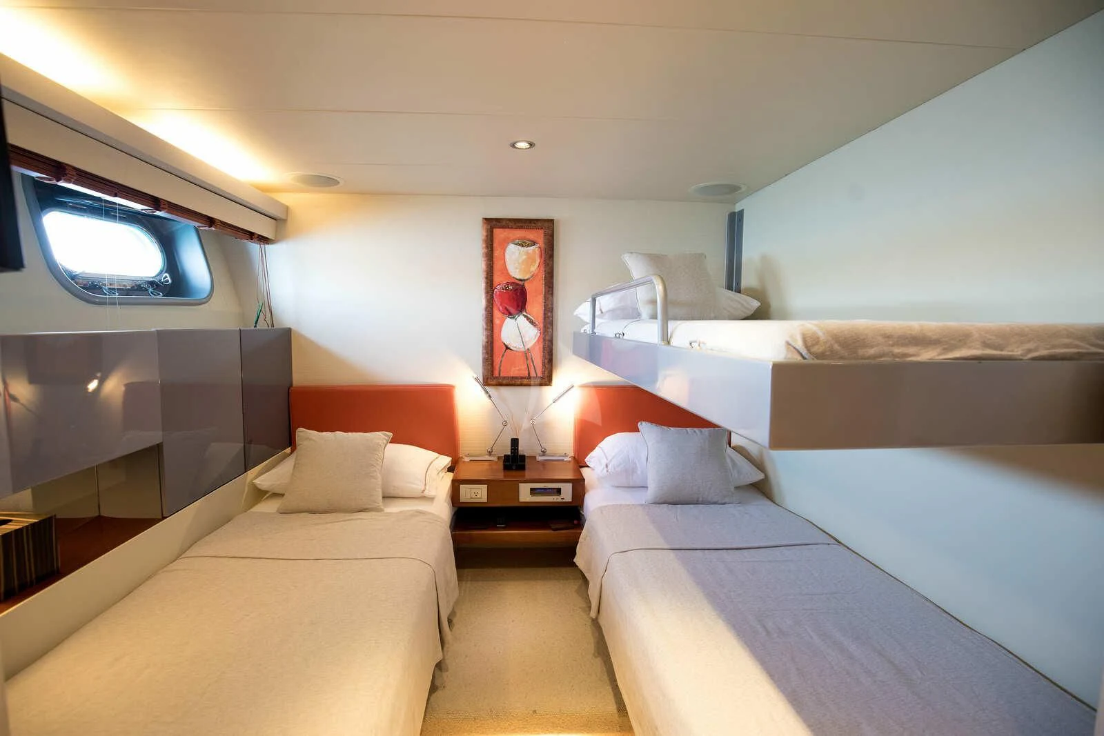 a room with beds and a mirror aboard HEARTBEAT OF LIFE Yacht for Sale