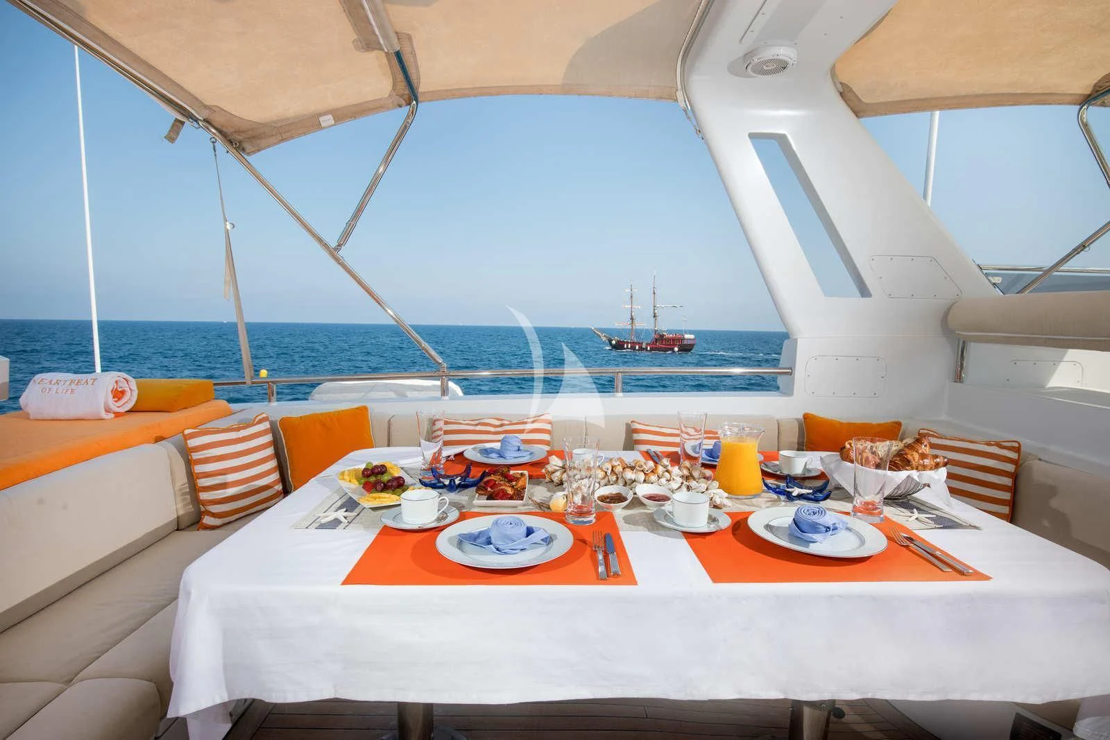 a table set for a meal aboard HEARTBEAT OF LIFE Yacht for Sale