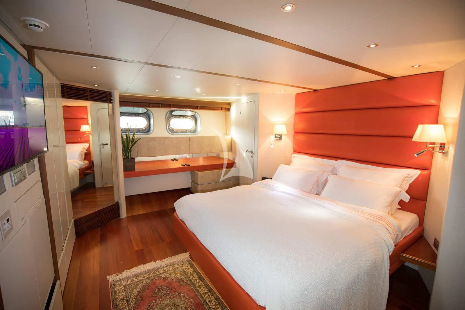 a room with a bed and a television aboard HEARTBEAT OF LIFE Yacht for Sale