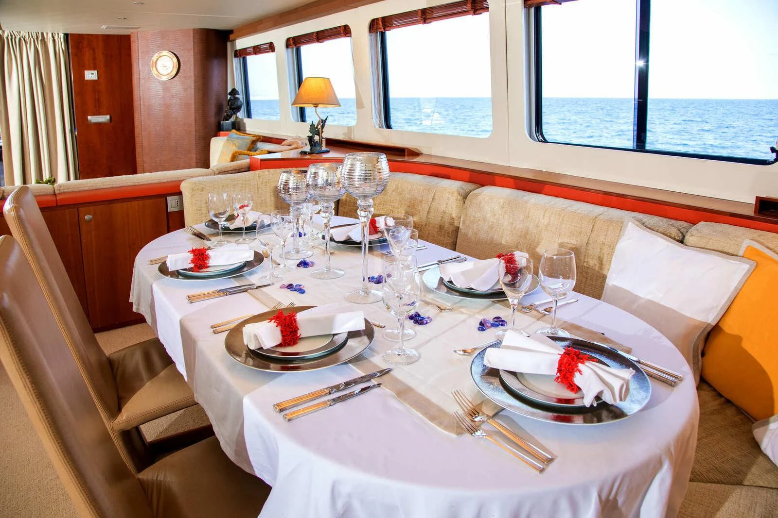 a table set with plates and glasses aboard HEARTBEAT OF LIFE Yacht for Sale