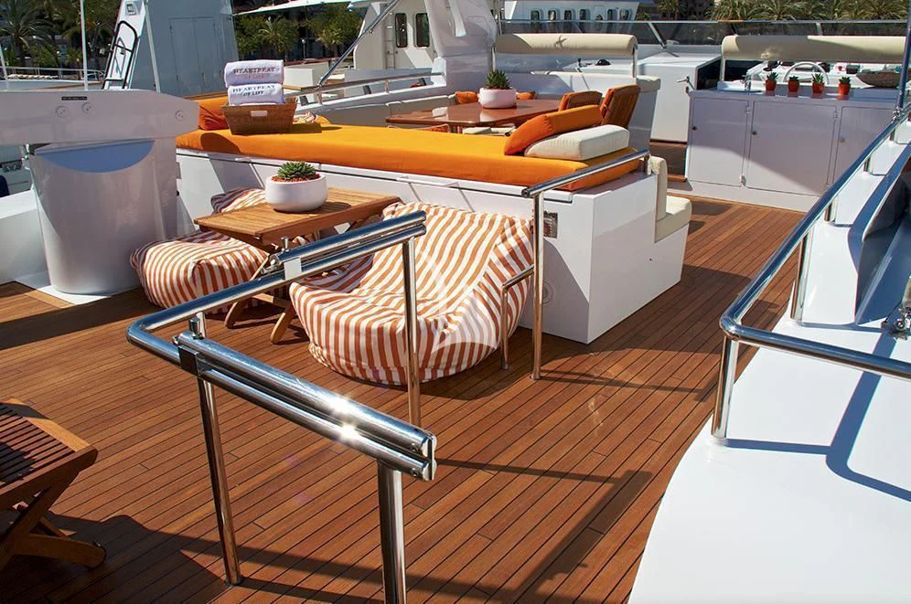 a table with chairs on it aboard HEARTBEAT OF LIFE Yacht for Sale