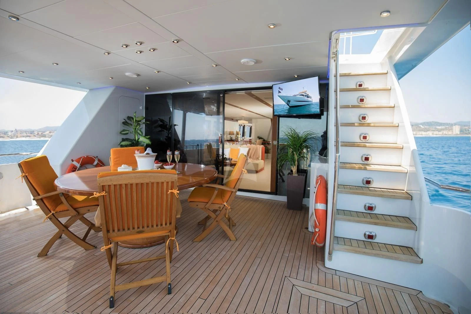 a room with a table and chairs aboard HEARTBEAT OF LIFE Yacht for Sale