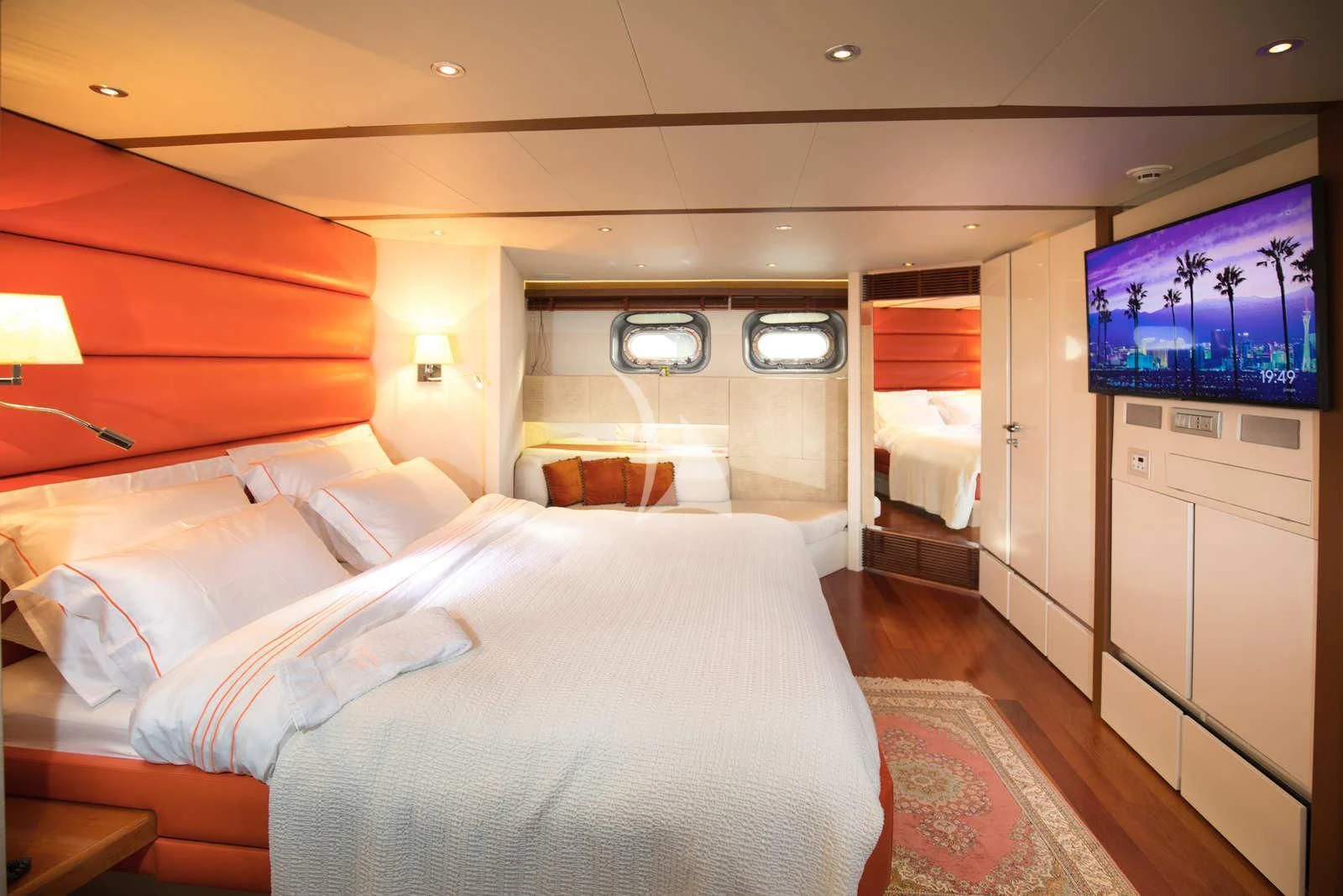 a room with a bed and a television aboard HEARTBEAT OF LIFE Yacht for Sale