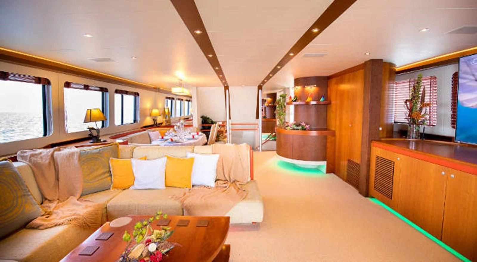a living room with a couch and a table aboard HEARTBEAT OF LIFE Yacht for Sale
