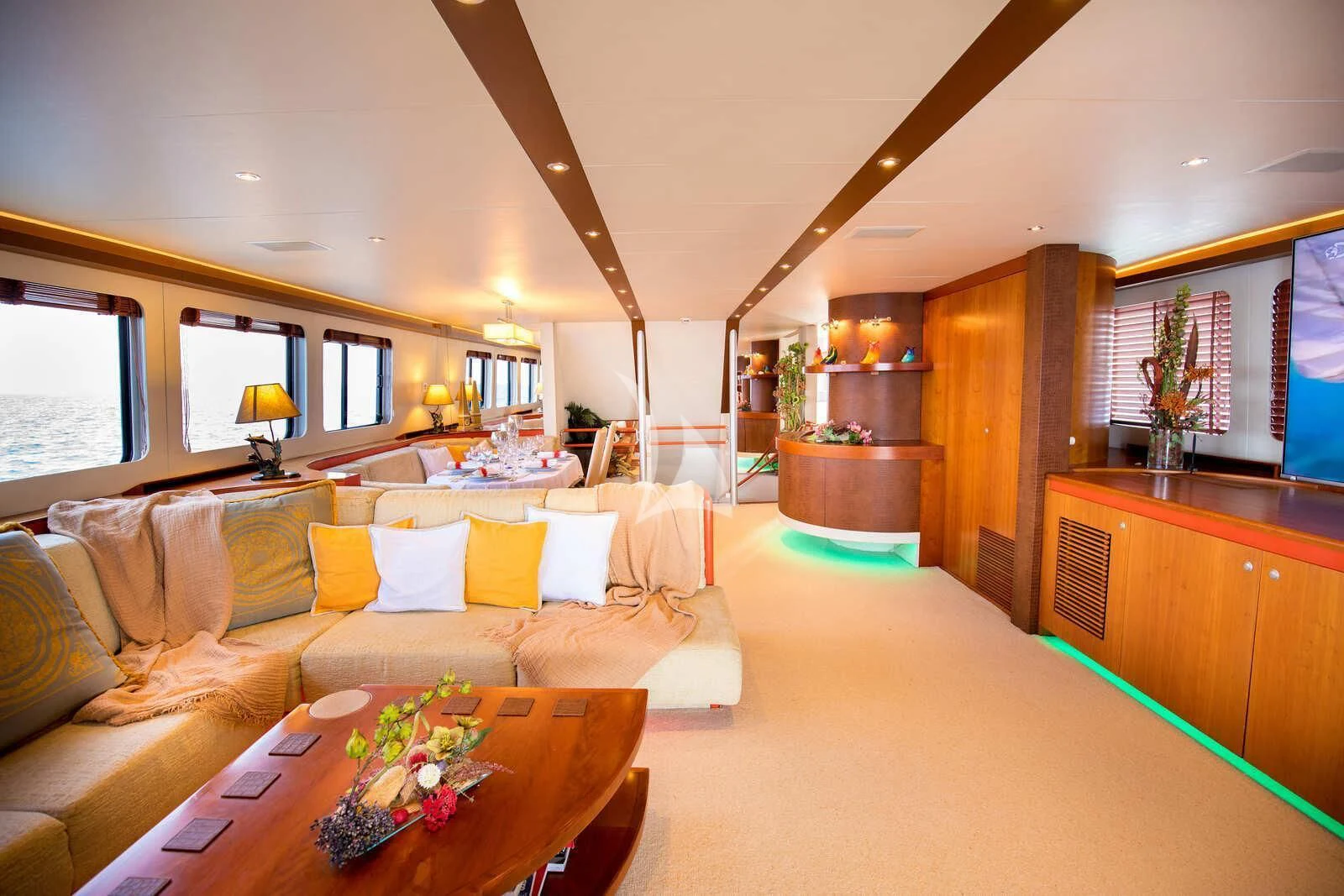 a living room with a couch and a table aboard HEARTBEAT OF LIFE Yacht for Sale
