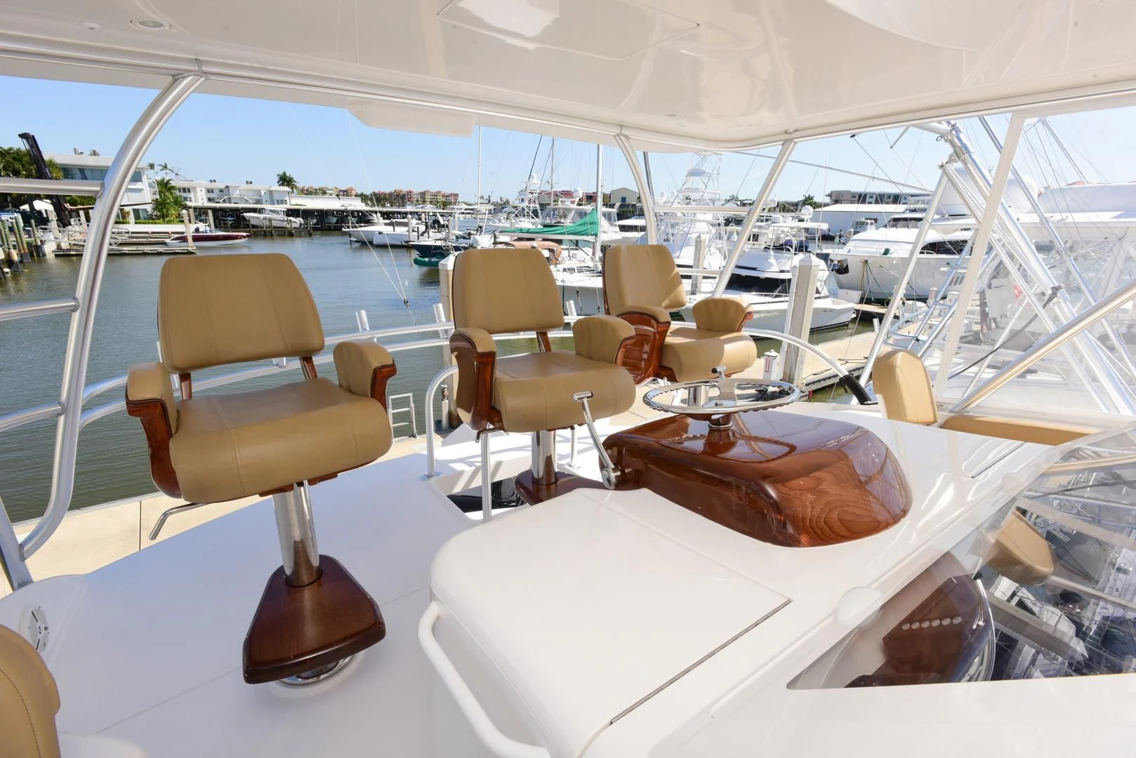 a boat with chairs and tables aboard CRAZY J Yacht for Sale
