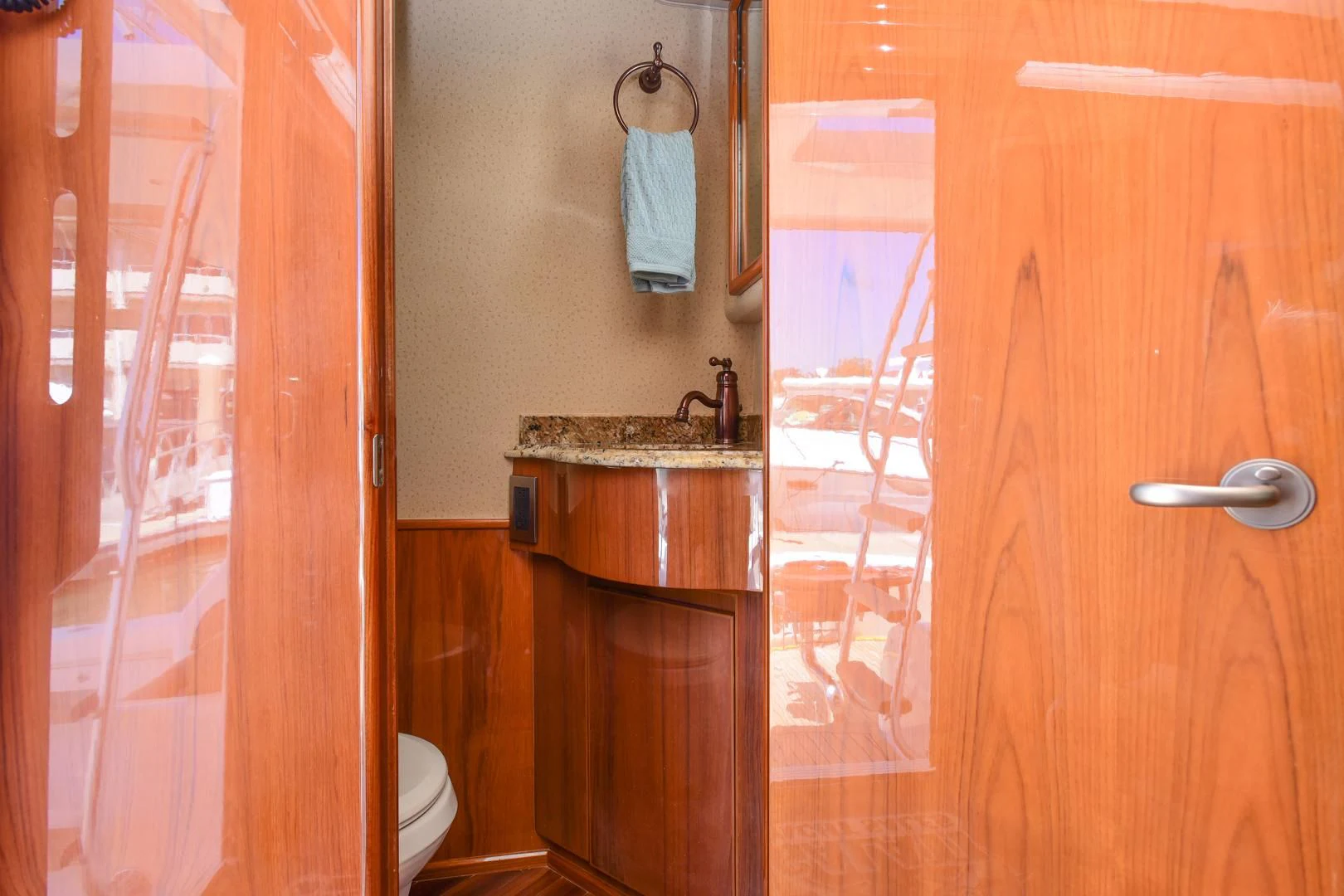 a bathroom with a sink and a toilet aboard CRAZY J Yacht for Sale