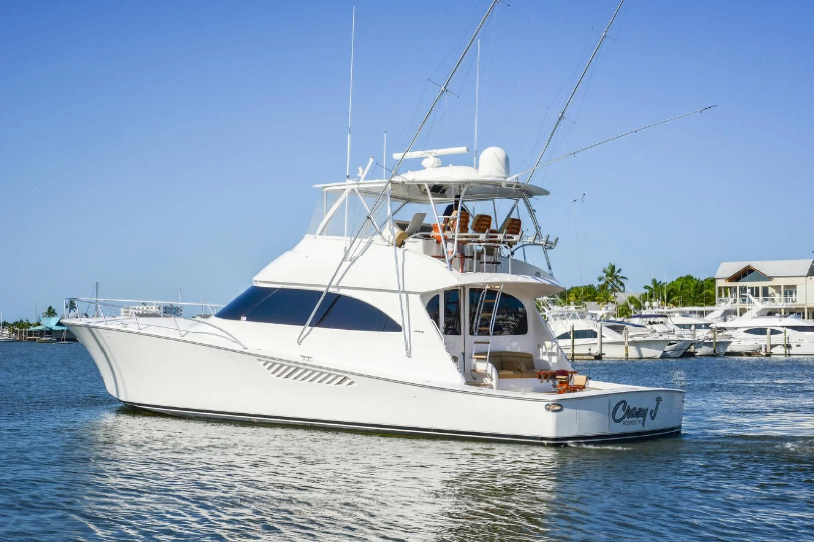 a white boat in the water aboard CRAZY J Yacht for Sale
