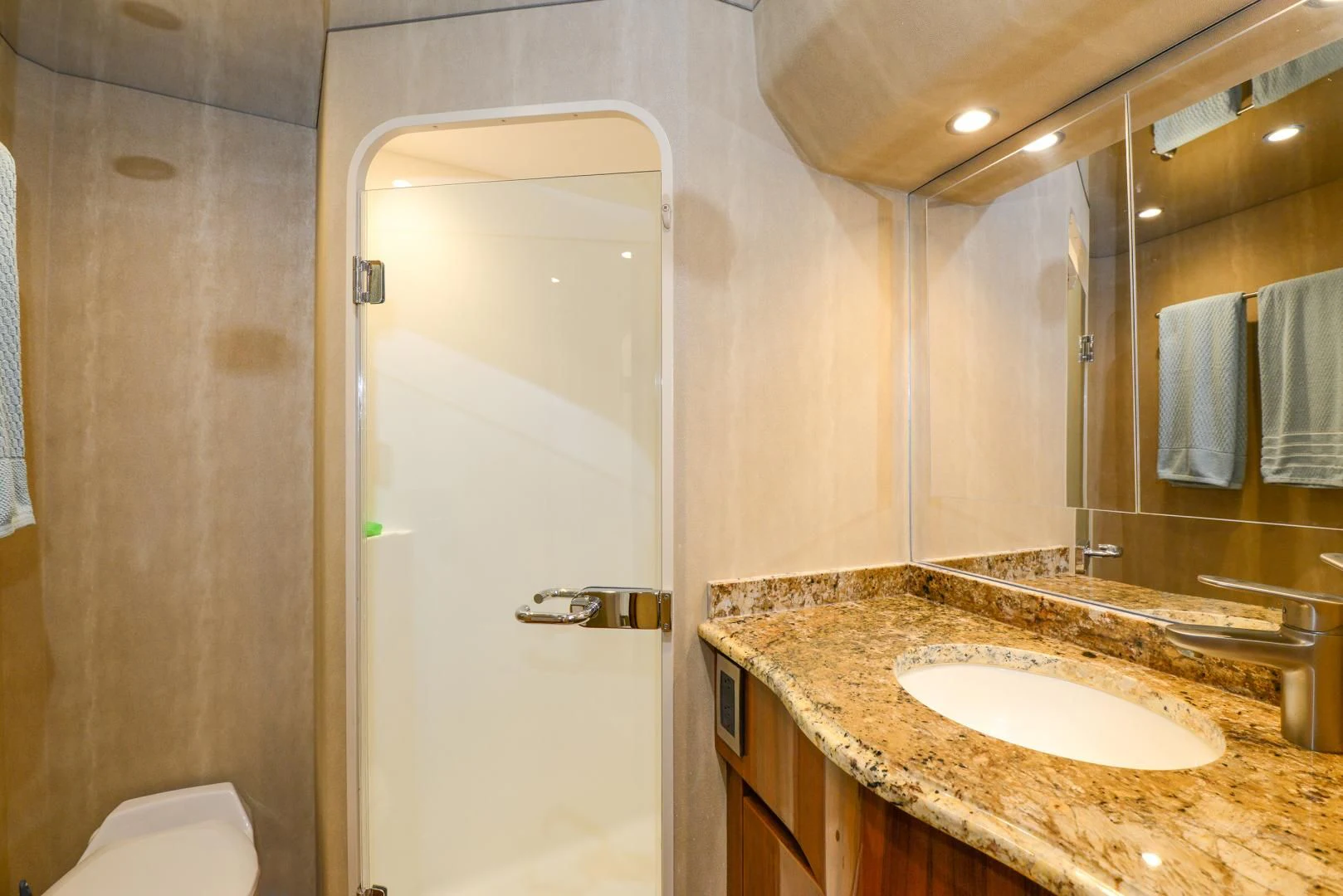 a bathroom with a large mirror aboard CRAZY J Yacht for Sale