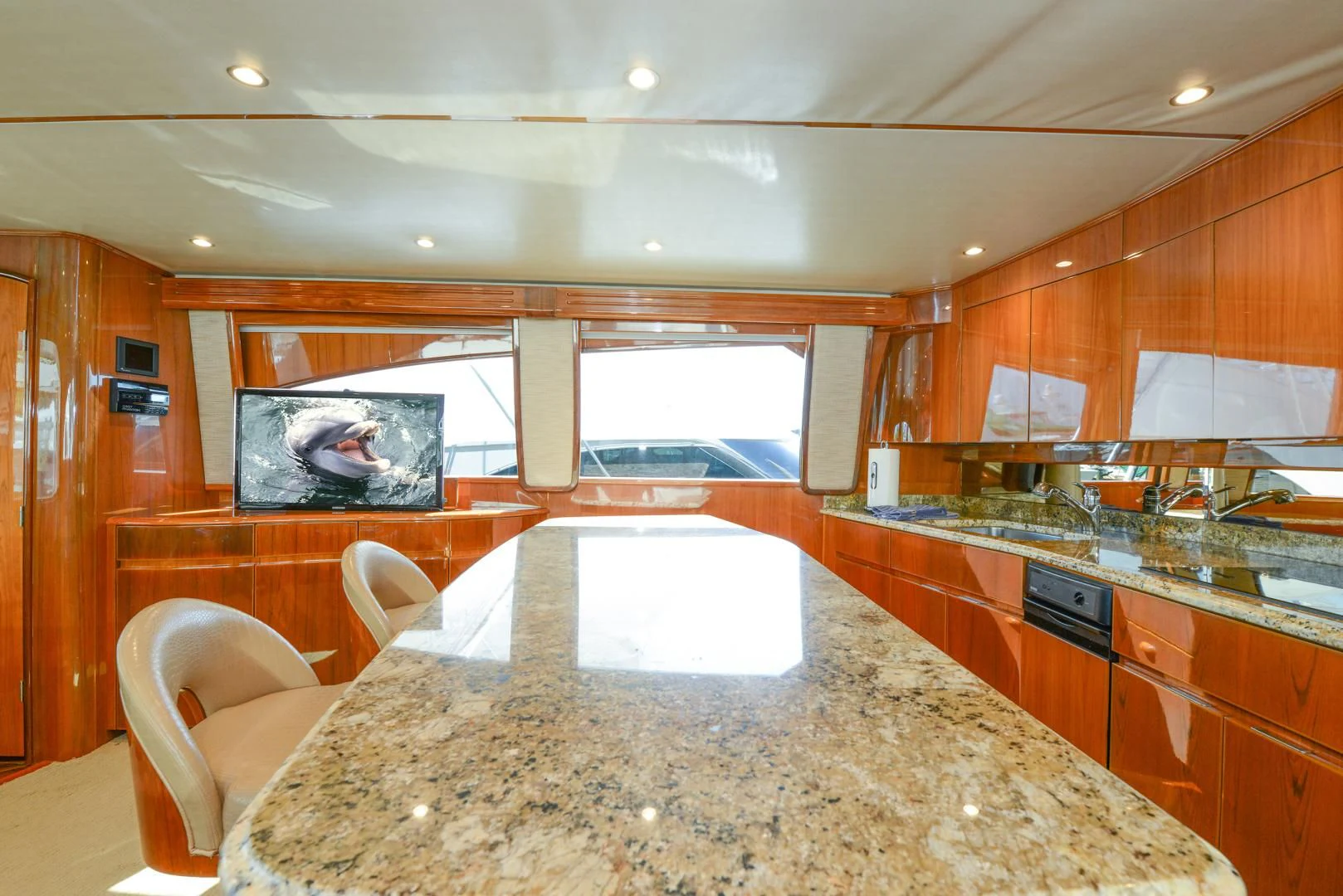 a large kitchen with marble counter tops aboard CRAZY J Yacht for Sale