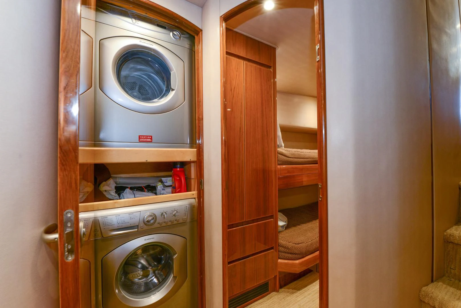 a room with a washer and dryer aboard CRAZY J Yacht for Sale