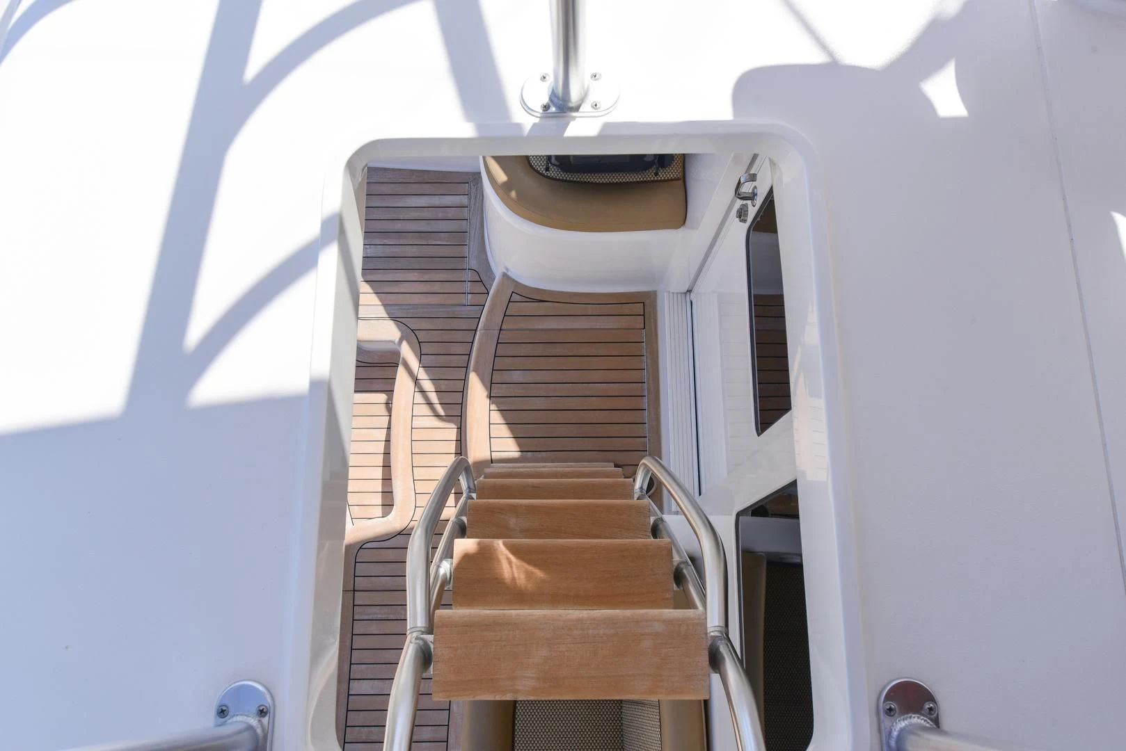 a set of stairs leading up to a blue wall aboard CRAZY J Yacht for Sale
