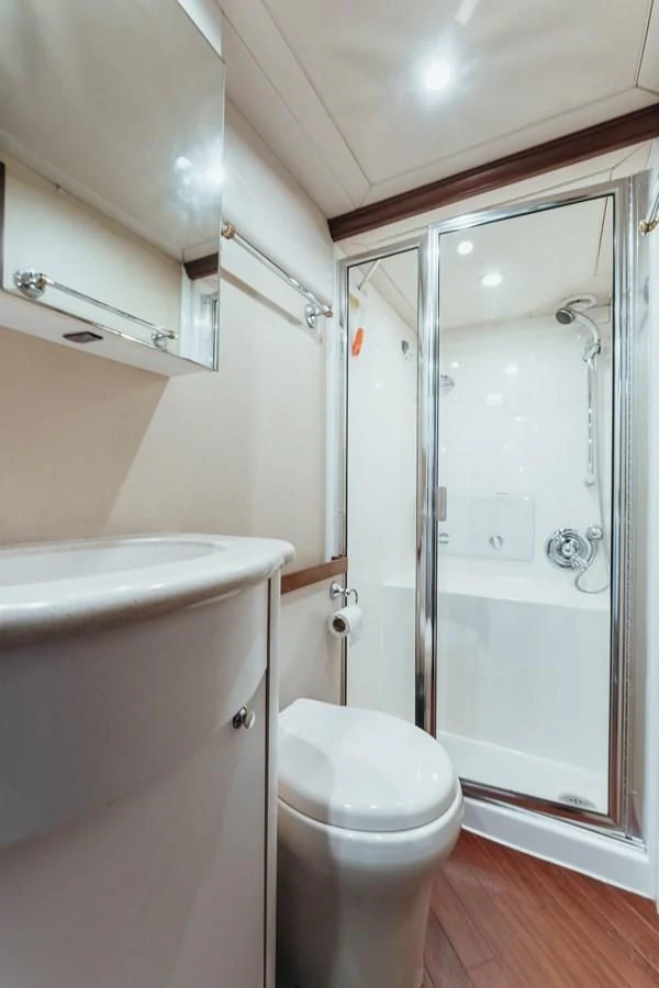 a bathroom with a shower and toilet aboard FINAL FINAL Yacht for Sale