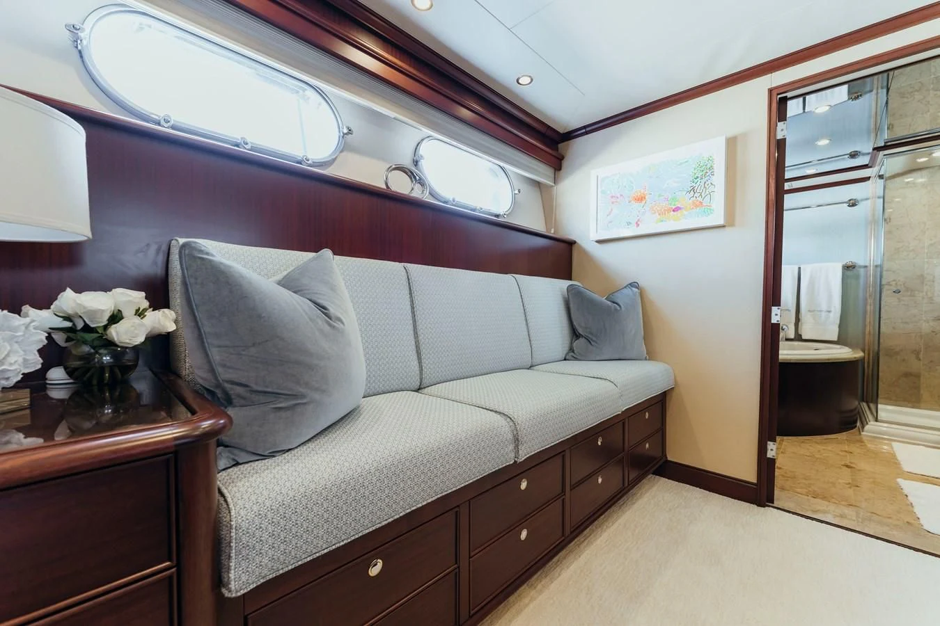a living room with a couch and a window aboard FINAL FINAL Yacht for Sale
