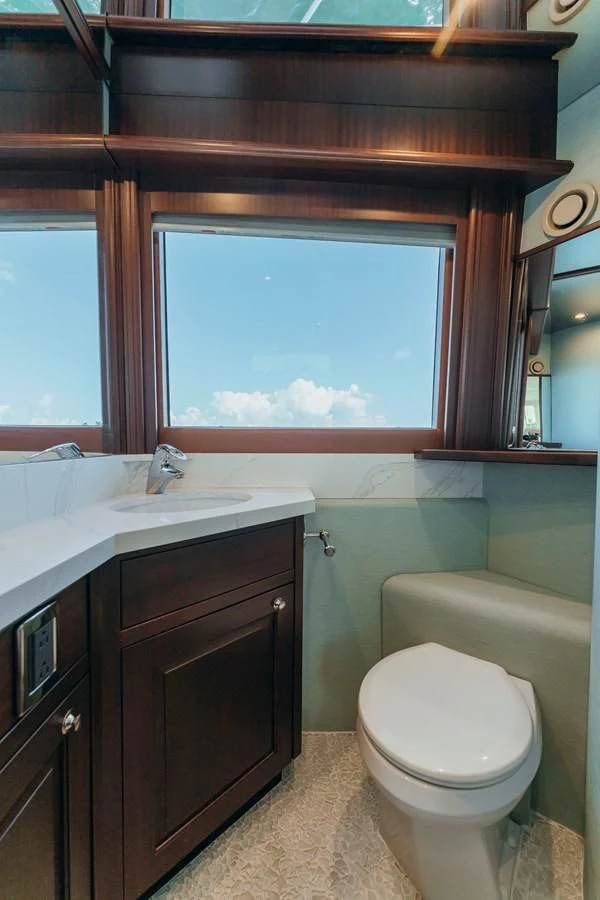 a bathroom with a sink and a toilet aboard FINAL FINAL Yacht for Sale