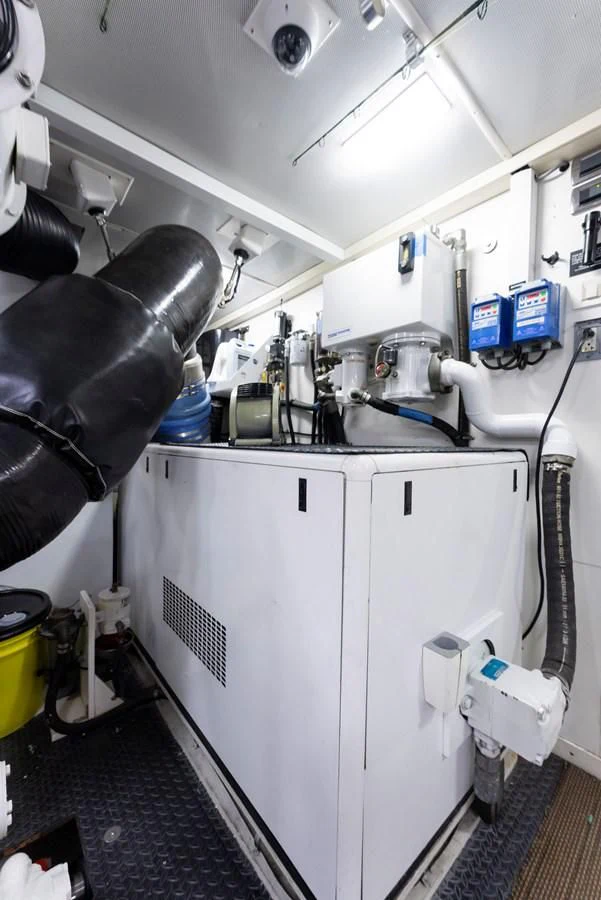 a white cabinet with a black object on it aboard FINAL FINAL Yacht for Sale