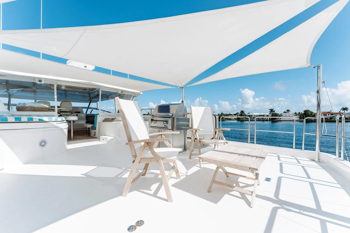 a deck with chairs and a pool aboard FINAL FINAL Yacht for Sale