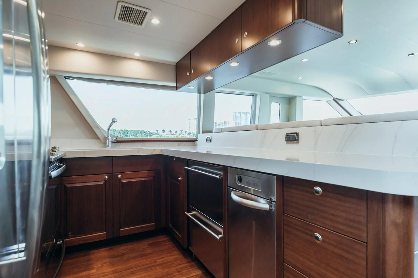 a kitchen with black cabinets aboard FINAL FINAL Yacht for Sale