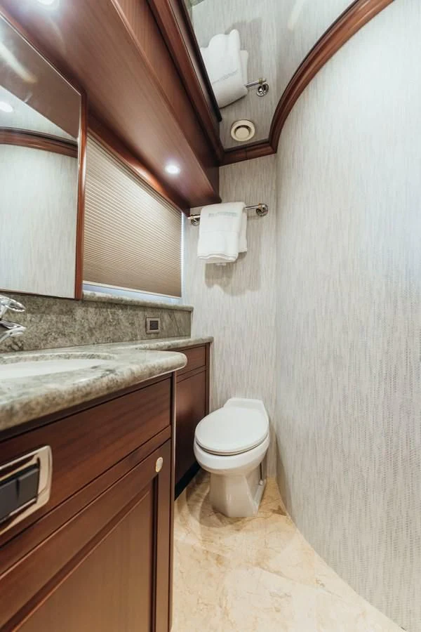 a bathroom with a toilet and a sink aboard FINAL FINAL Yacht for Sale