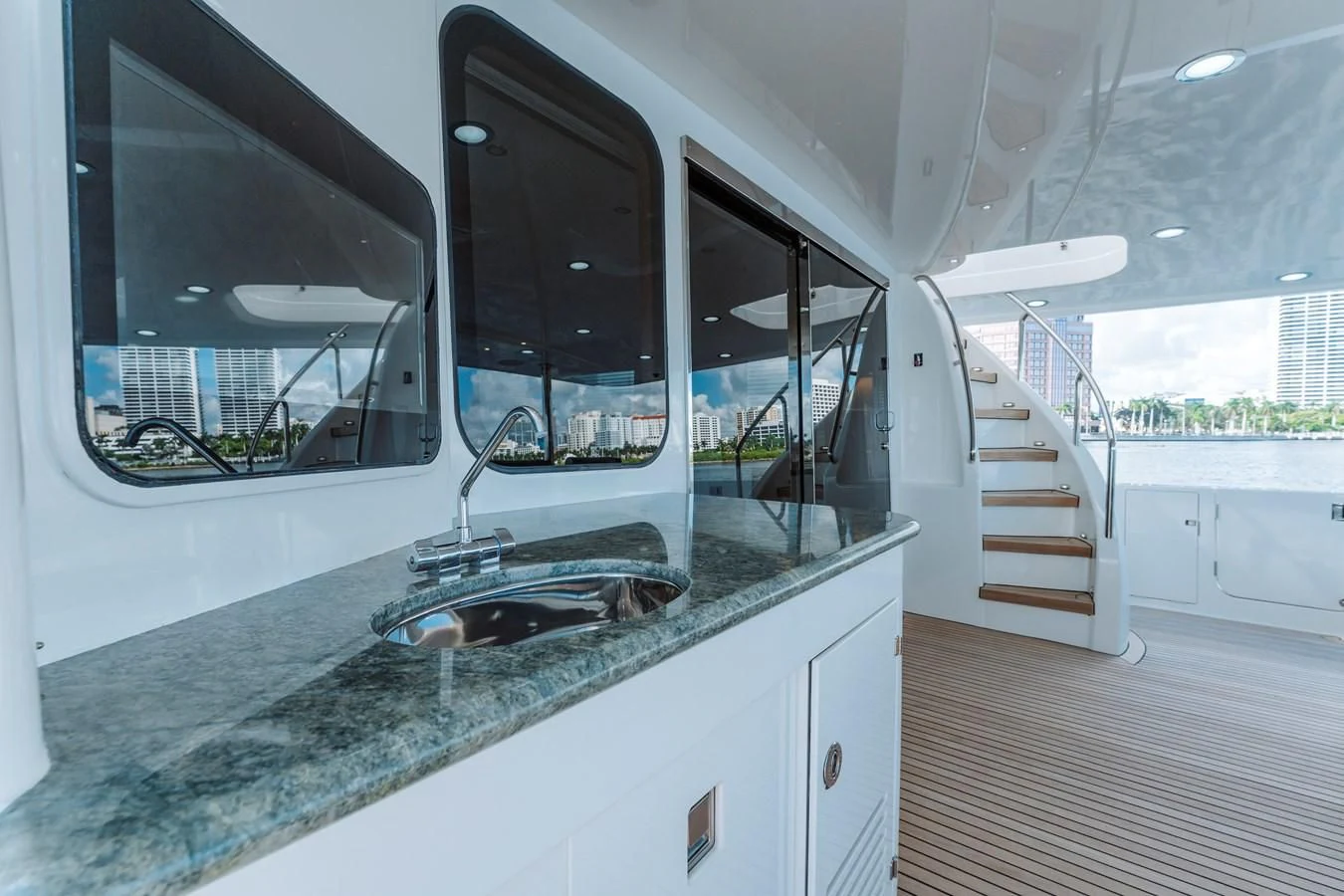 a kitchen with a sink and a staircase aboard FINAL FINAL Yacht for Sale