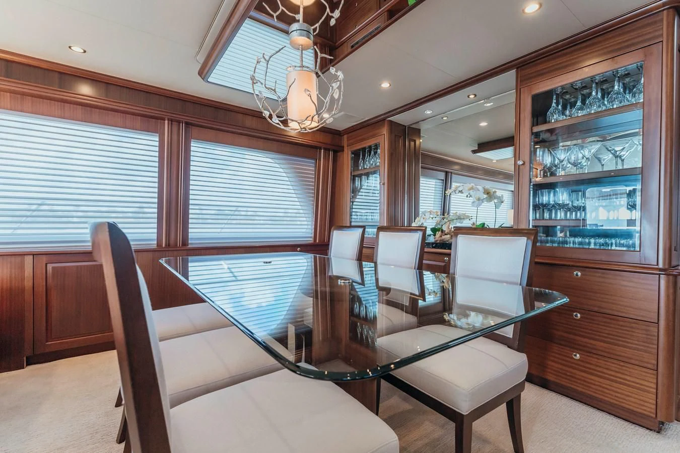 a room with a large table and chairs aboard FINAL FINAL Yacht for Sale