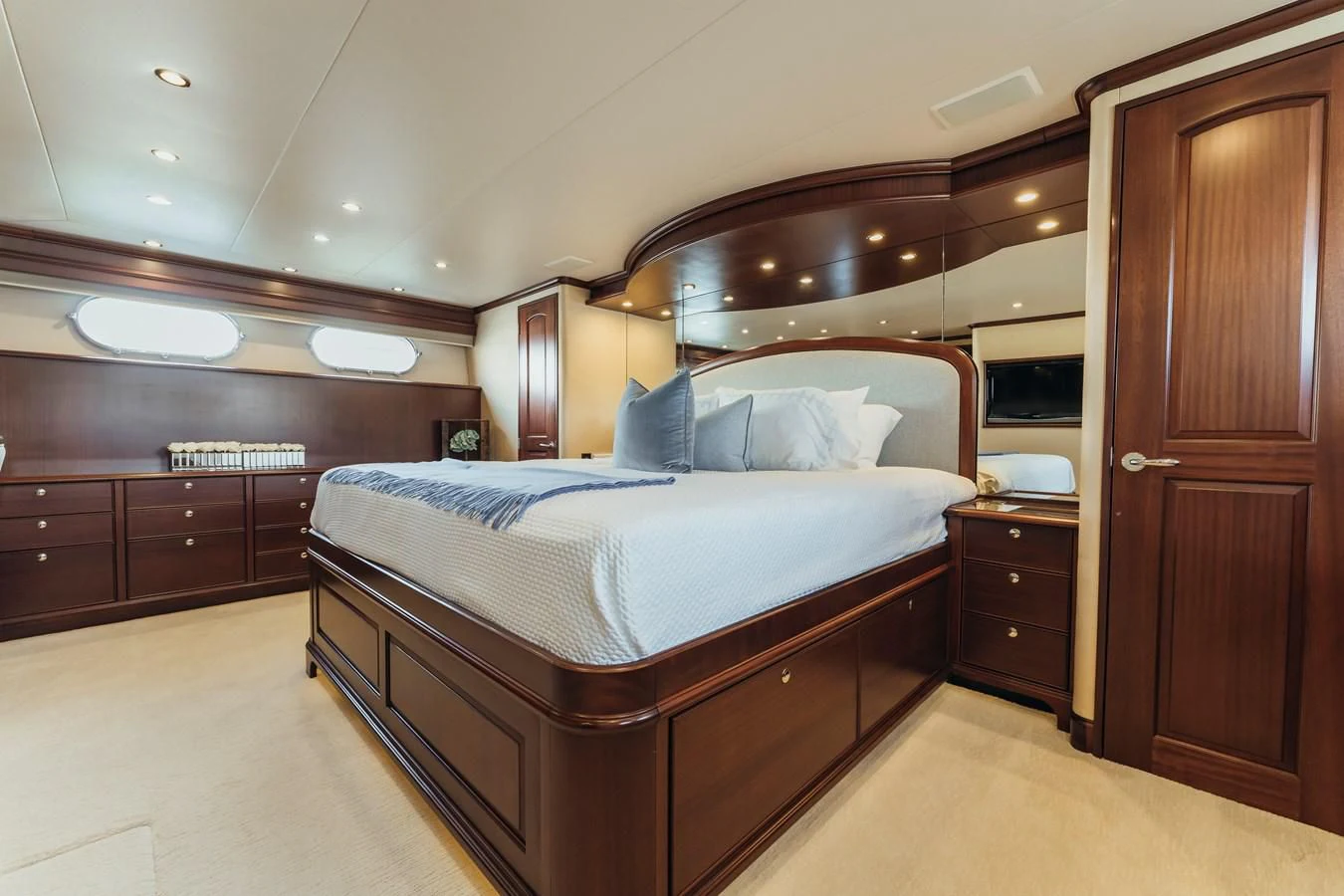a bedroom with a bed and a closet aboard FINAL FINAL Yacht for Sale